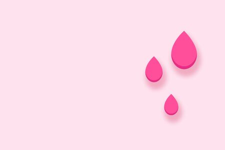 Drops of blood on a pink background. Female health menstruation cycle concept.Top view copy spaceの写真素材