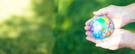 Female hands hold a globe. Ecological disaster concept. Save the planet
