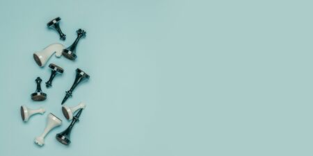 Chess figures on a blue background with copy space, top view, flat lay. Leadership or competition concept.の写真素材