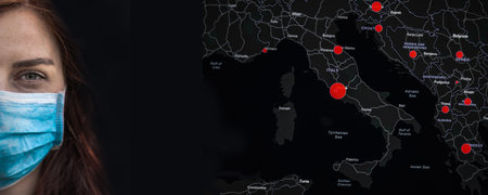 Coronavirus Covid 19. Female face in a medical surgical mask with copyspace on a world map...