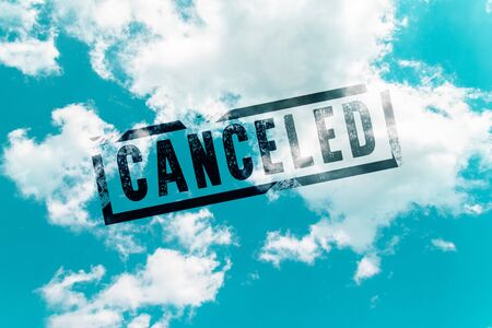 Sky in the clouds and the inscription Flights canceled. Coronavirus, covid 19 conceptの写真素材