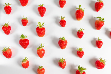 Organic delicious strawberry berries seamless pattern on grey background, top view, flat lay. Summer...