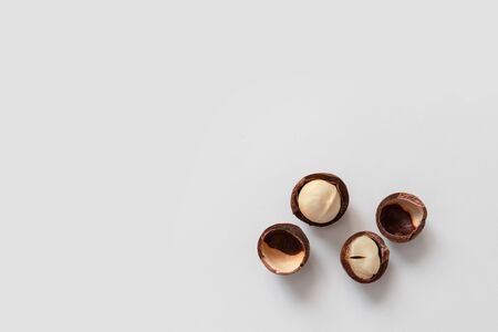 Top view of macadamia nut shells scattered on gray backgroundの写真素材