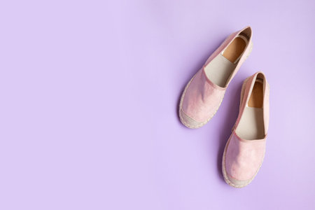 Stylish new shoes on a colored background, top view. Top view, flat lay