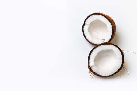 Two halves of raw coconut on gray background. Healthy healthy food conceptの写真素材