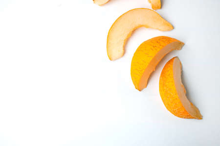 Top view fresh delicious slices melon on white background with copy space. Summer fruit conceptの写真素材