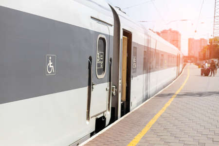 The high-speed train stands at the station of the station before leaving for the journeyの写真素材