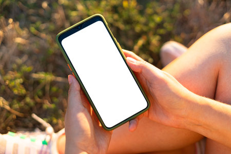 Mockup image blank white screen smartphone. Woman hand holding, using mobile