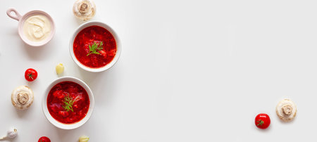 Traditional home Ukrainian beet soup with fresh green dill. Russian borscht in bowl of tomatoes,...