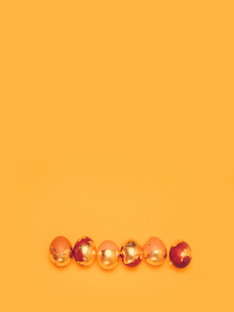 Holiday Easter golden and bronze eggs. Happy Easter concept. Flat lay, top view.