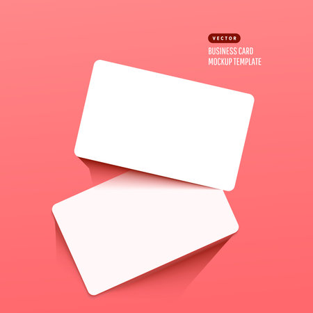 Horizontal white business cards on a bright pink background. Realistic mockup card.のイラスト素材