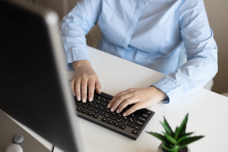 Young businesswoman working on a computer in the office or at home workplace