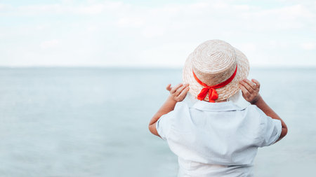 Pretty beautiful women with hat having fun and relax sunbathing on the beach in the summer, travel...