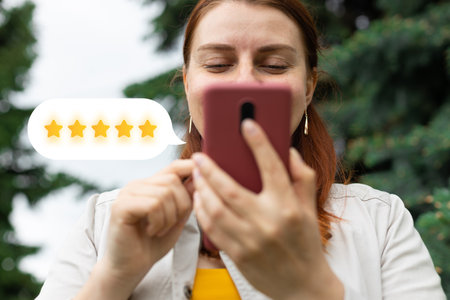 Excellent. Woman using mobile phone with icon five star symbol to increase rating of company, customer service conceptの写真素材