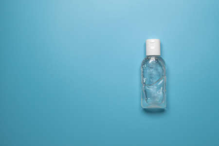 Alcohol hand sanitizer gel bottles for hand hygiene virus protection on blue background, top viewの写真素材