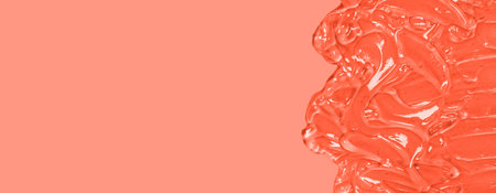 Liquid gel cosmetic smudge orange background. Antibacterial, hydro alcoholic gel, ethyl alcohol. Virus protection or cosmetics conceptの写真素材