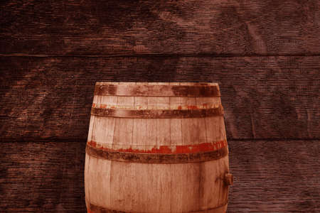 background of Oktoberfest barrel and worn old table of woodの写真素材