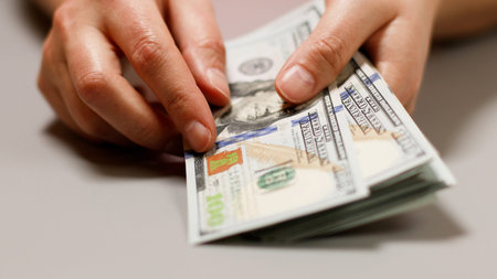 American money in female hand. Economy concepts.