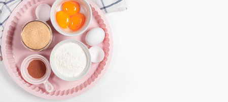Baking homemade bread on white kitchen worktop with ingredients for cooking, culinary background,...