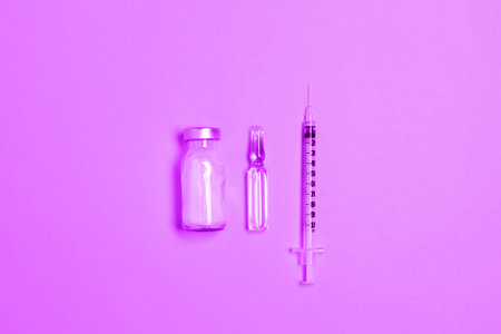Virus vaccine for immunization against  and syringe on color backgroundの写真素材