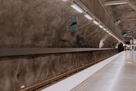 Modern urban underground transport station with urban fixtures.の写真素材
