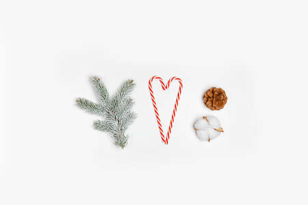 Christmas composition. Christmas candy canes and fir branches. Christmas, winter, new year concept. Flat lay, top viewの写真素材