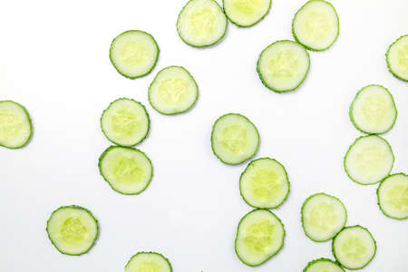 Cucumber pattern with many round slices on white background, top view.の写真素材