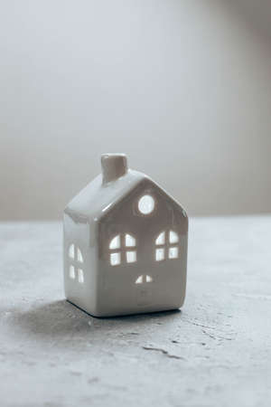 White cozy home model on a gray background. Flat lay, top view. Xmas and New Year theme.の写真素材