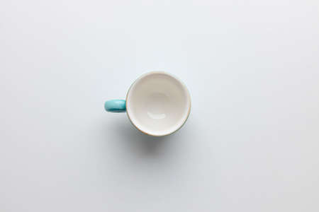 Empty white blue coffee cup on white backgroundの写真素材