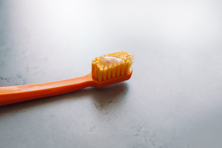Color toothbrushes on table against color background. Dental health at home.