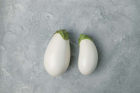 Two fresh eggplant vegetable over white background. Healthy diet vegetarian food. Vegetables, top view flat layの写真素材