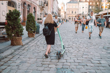 Lviv, Ukraine - July 6, 2021: People tourists walk along the city street on a summer sunny day. A street in historical Old town of Lviv, Ukraine.のeditorial素材