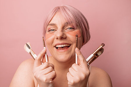 Young beautiful smile european woman does natural makeup. Portrait of girl with professional makeup...