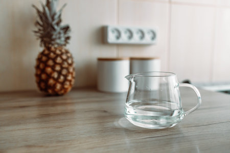 A glass of fresh water in crafin modern kitchen.の写真素材