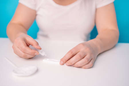 Womanholding Positive  test. Medicine, quarantine and pandemic conceptの写真素材