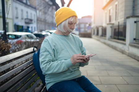 Business woman hands using mobile phone while going to work