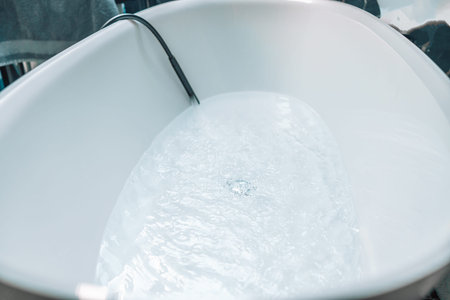 A clean bathtub with hot waterの写真素材