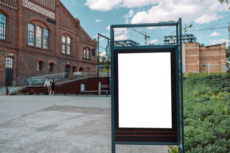 Blank mock up of vertical street poster billboard on city background for display your products or promotionalの写真素材