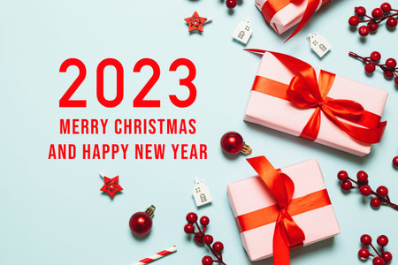 2023 Happy New Year and Merry Christmas. Christmas blue background design with garland, realistic...