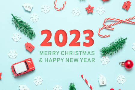 2023 Present gift or present boxes with red bows, 2023 numbers and stars confetti top view....