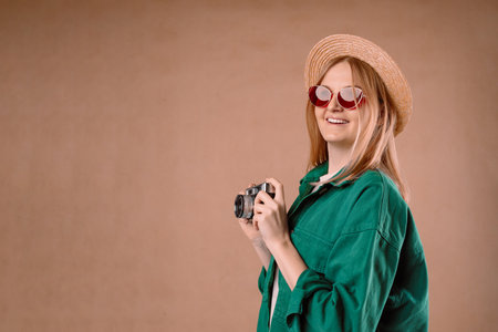 Horizontal banner of excited senior blonde woman over isolated background with a professional cameraの写真素材