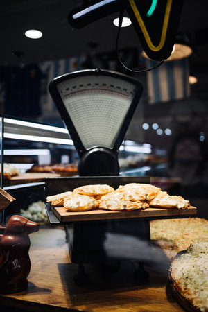 Shop window with vintage scales and baked piesの写真素材