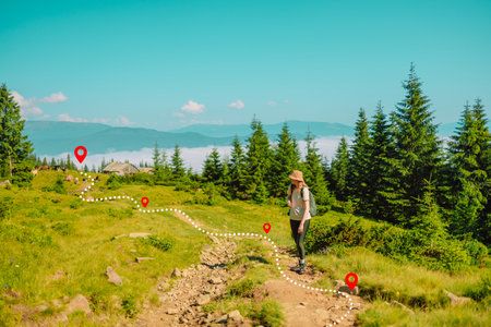 Travel and active lifestyle concept. Happy smiling woman hiking in mountainsの写真素材