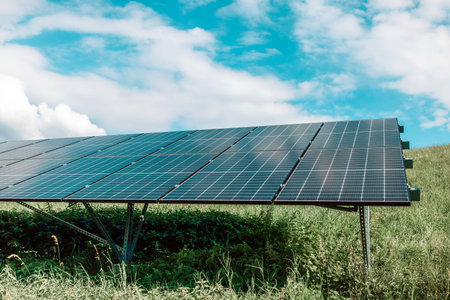 Solar panels on the sky background. Solar power plant. Blue solar panels. Alternative source of...