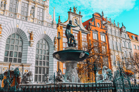 Neptunes Fountain, a famous historical landmark and colorful gothic houses in Gdansk, Poland,...