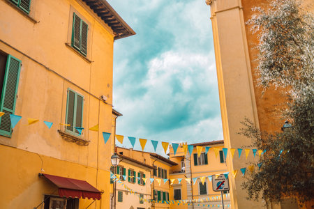 Beautiful European cozy town with colorful old buildings and a street in Pisa, Italy. Traveling in a vintage city. High quality photoの写真素材