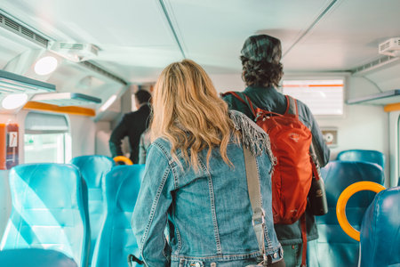 Back view of crowded caucasian people queue for to exit from public train during rush hour. High...