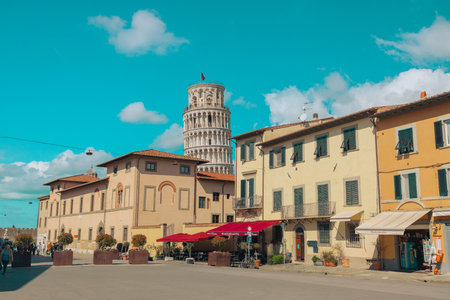 Pisa, Italy - March 18, 2023: Street parking on the hill in old city. The street with ancient buildings in the center of Pisa, Italy. Photo of the facades of old buildings in the historic center . High quality photoのeditorial素材