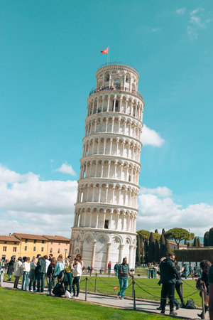 Pisa, Italy - March 18, 2023: Picturesque landscape with church and famous sloping tower in Pisa, Italy. fascinating exotic amazing places. High quality photoのeditorial素材