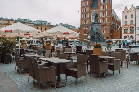 Krakow, Poland - May 2, 2023: Beautiful Krakow market square with a beautiful street cafe, Poland, Europe. Cozy place. High quality photoのeditorial素材